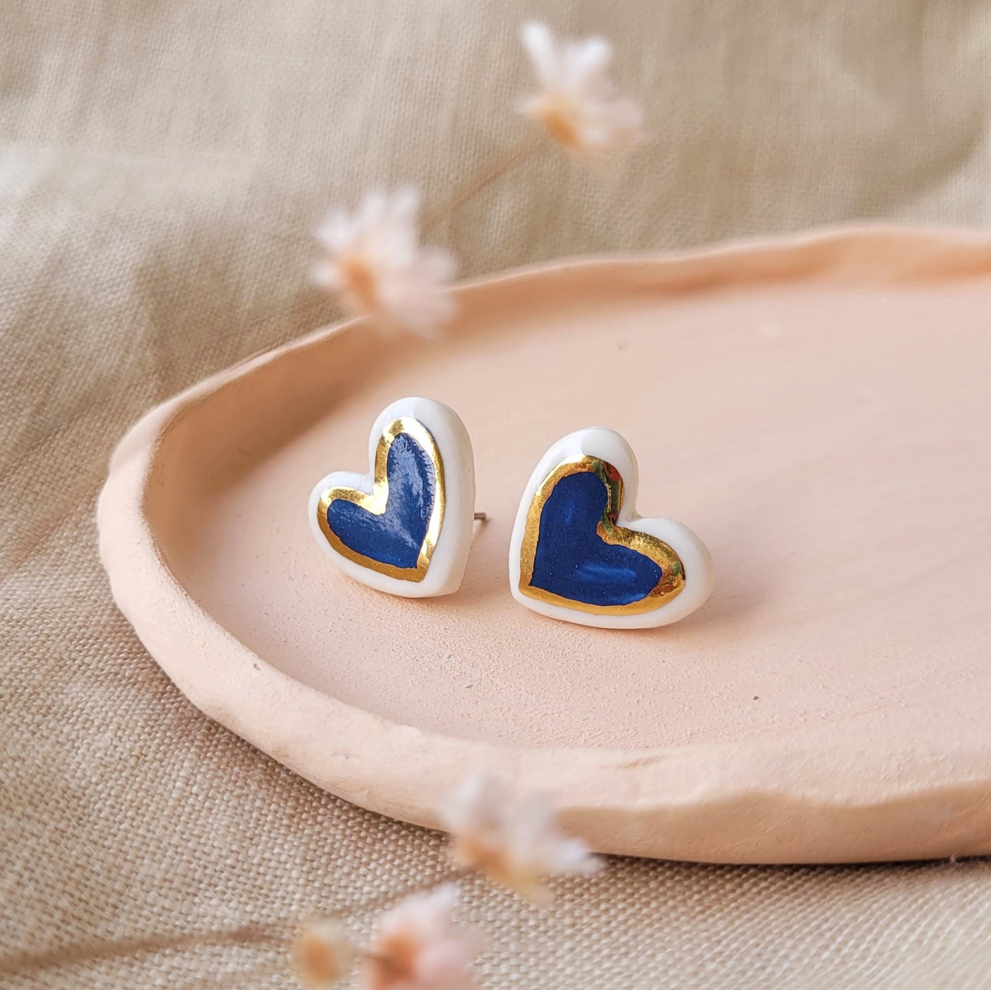 Porcelain stud earrings with gold "Dark blue hearts with gold"