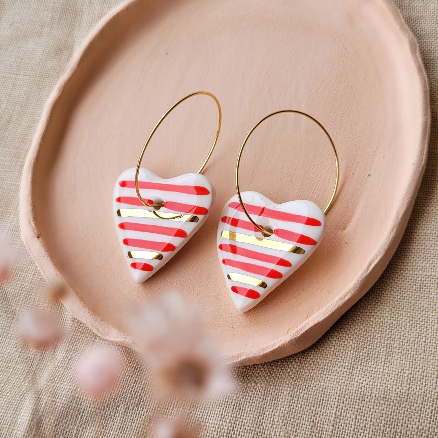 Porcelain dangle earrings with gold "Hearts with red stripes"