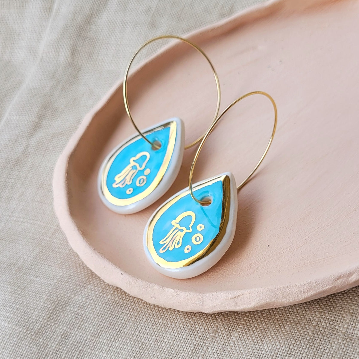Porcelain dangle earrings with gold "Jellyfish in blue"