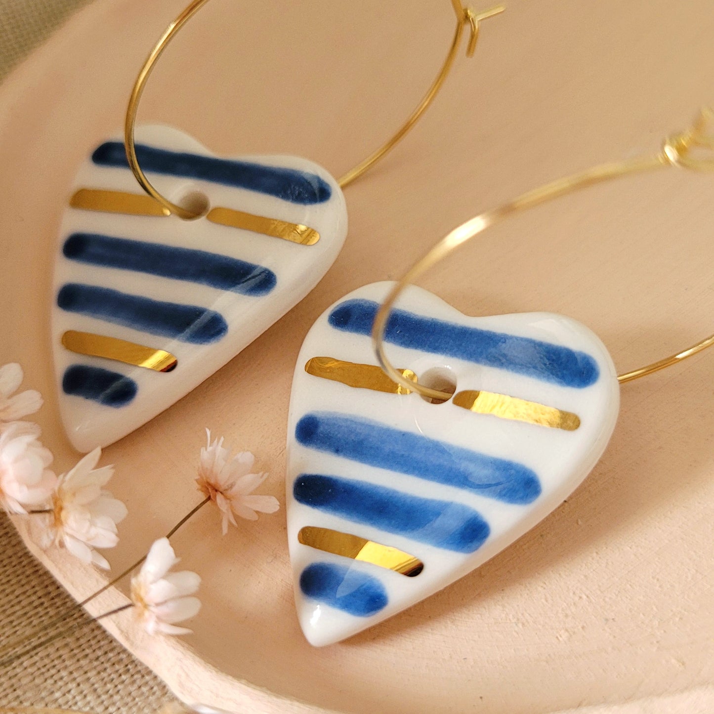 Porcelain dangle earrings with gold "Hearts with blue stripes"