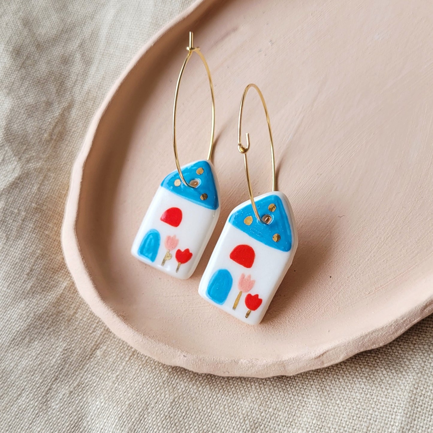 Porcelain dangle earrings with gold "Blue houses"