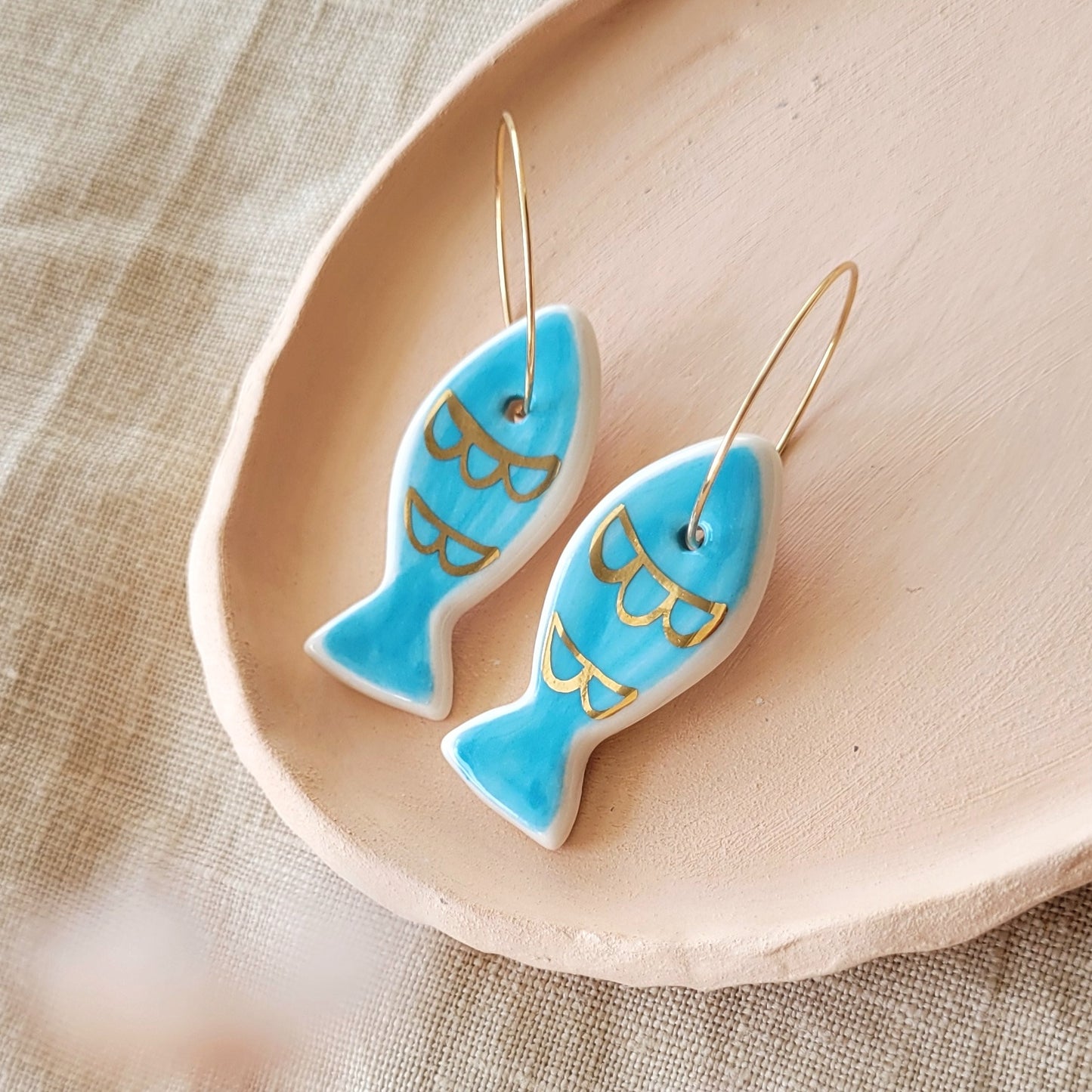 Porcelain dangle earrings with gold "Blue fish"