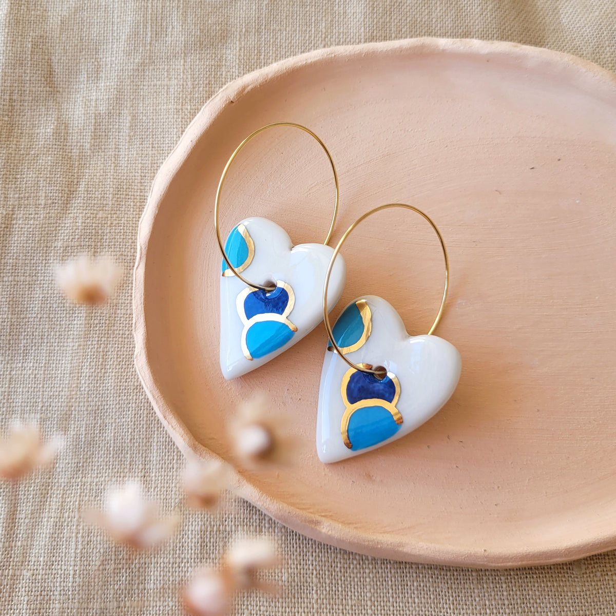 Porcelain dangle earrings with gold "Hearts white and blue"