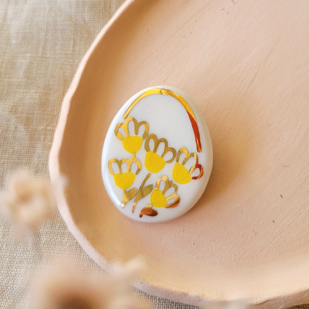 Porcelain brooch with gold "Flowers in yellow and gold"