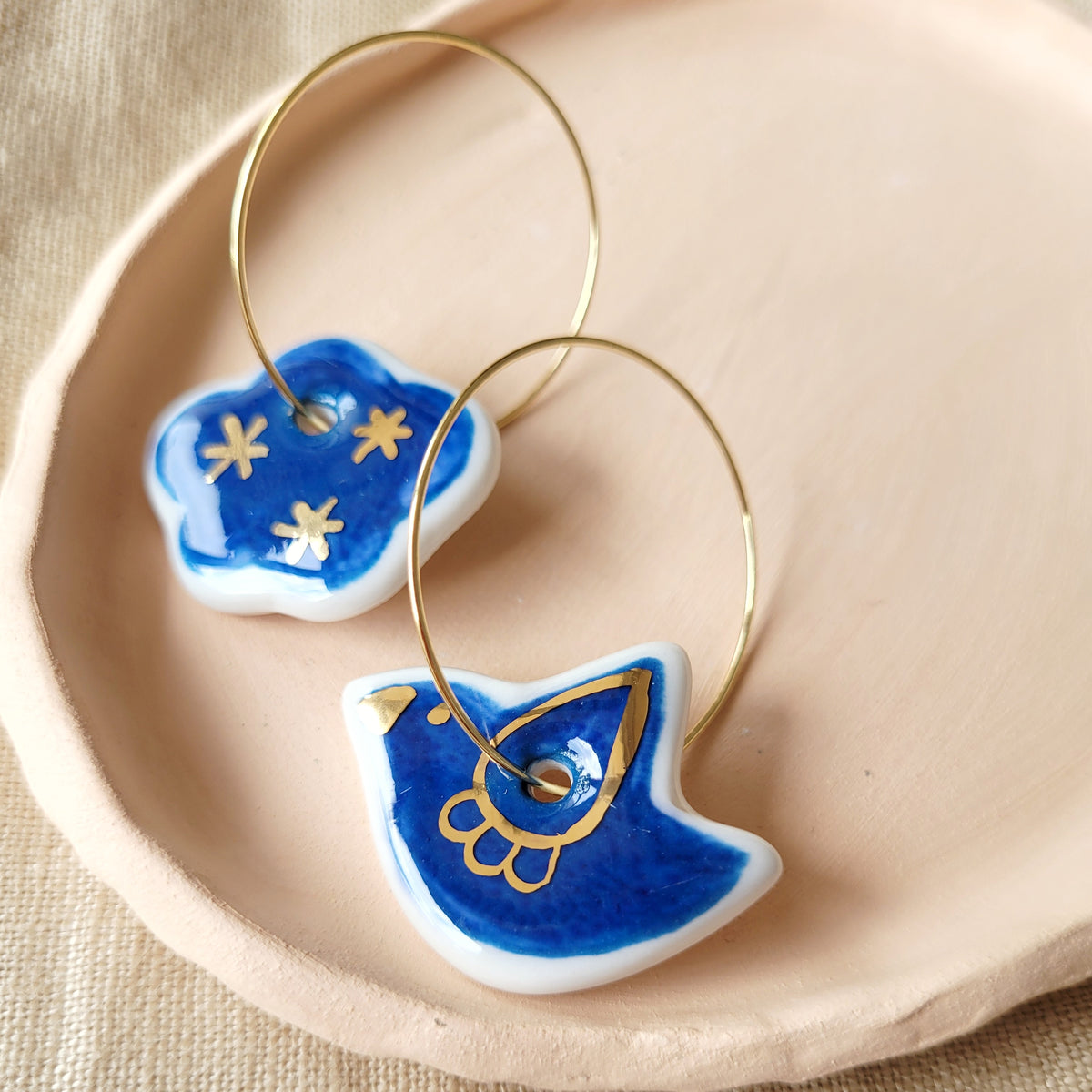 Porcelain dangle earrings with gold "Blue bird and cloud"