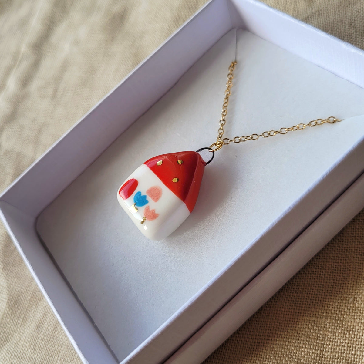 Porcelain necklace with gold "Red house with pink window"