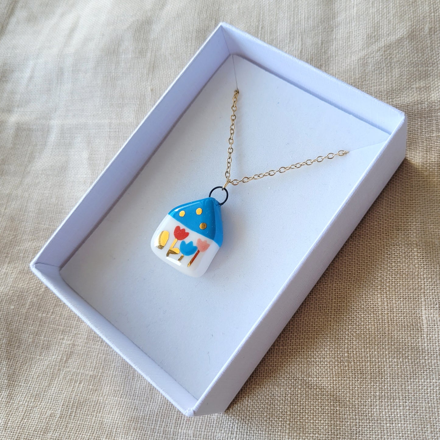 Porcelain necklace with gold "Blue house with tulips"