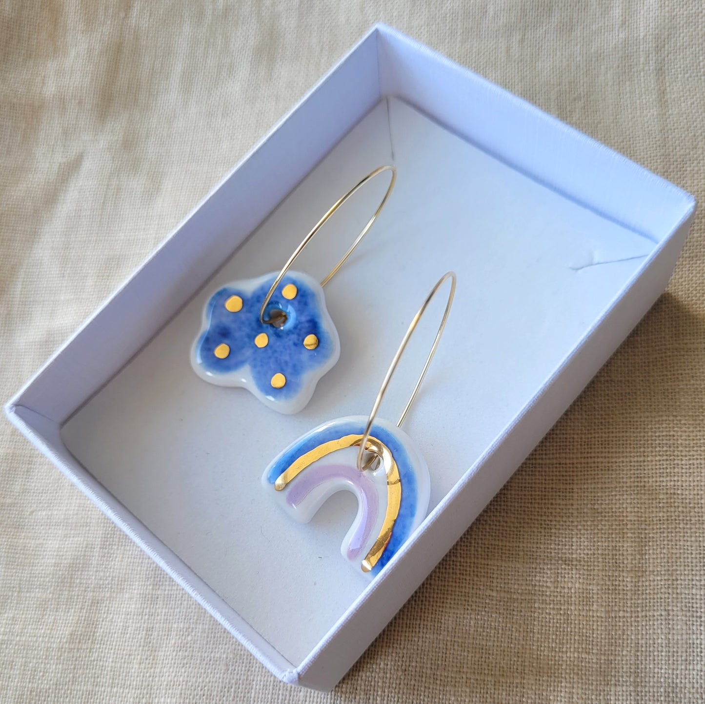 Porcelain dangle earrings with gold "Dark blue cloud and rainbow"
