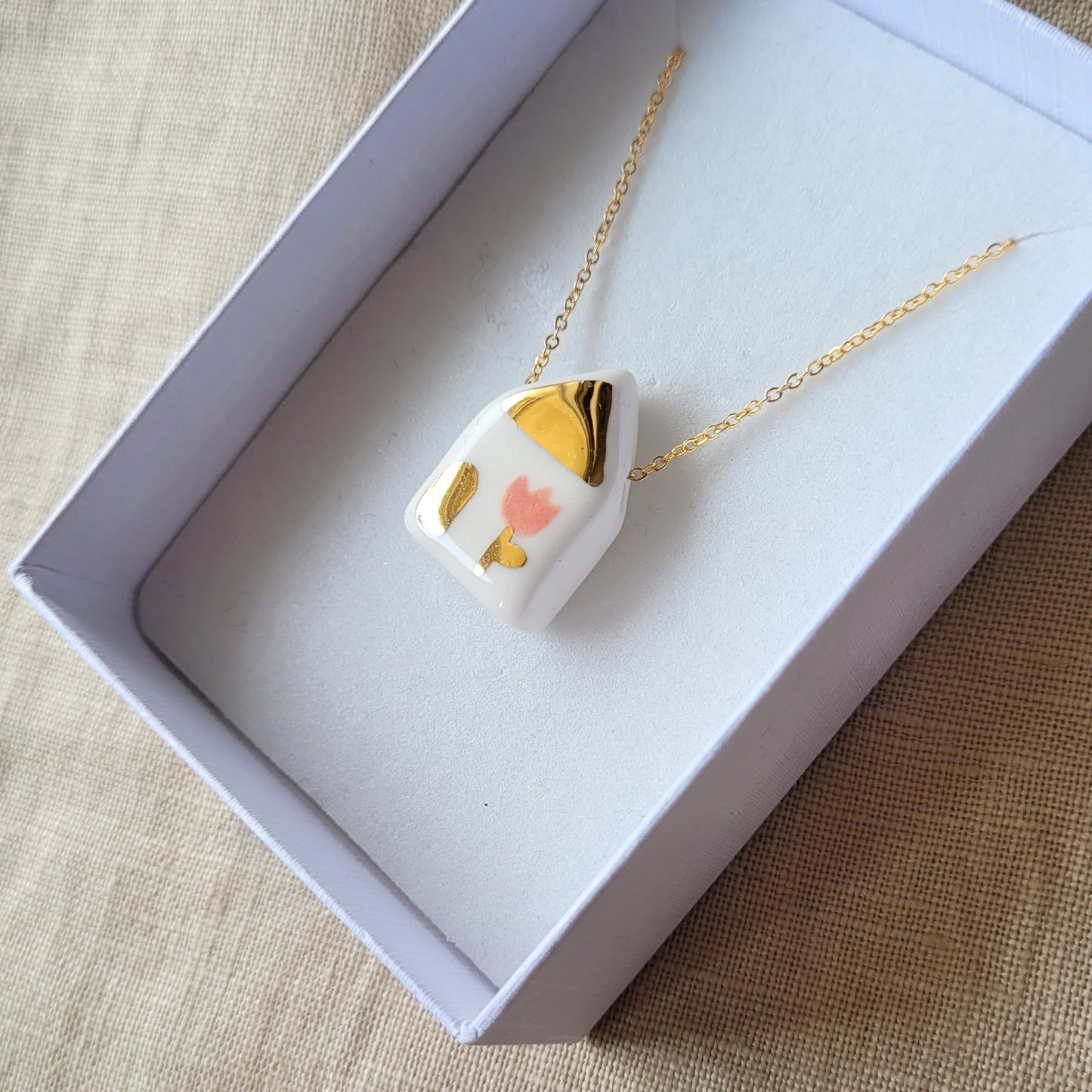 Porcelain necklace with gold "House with pink tulip"