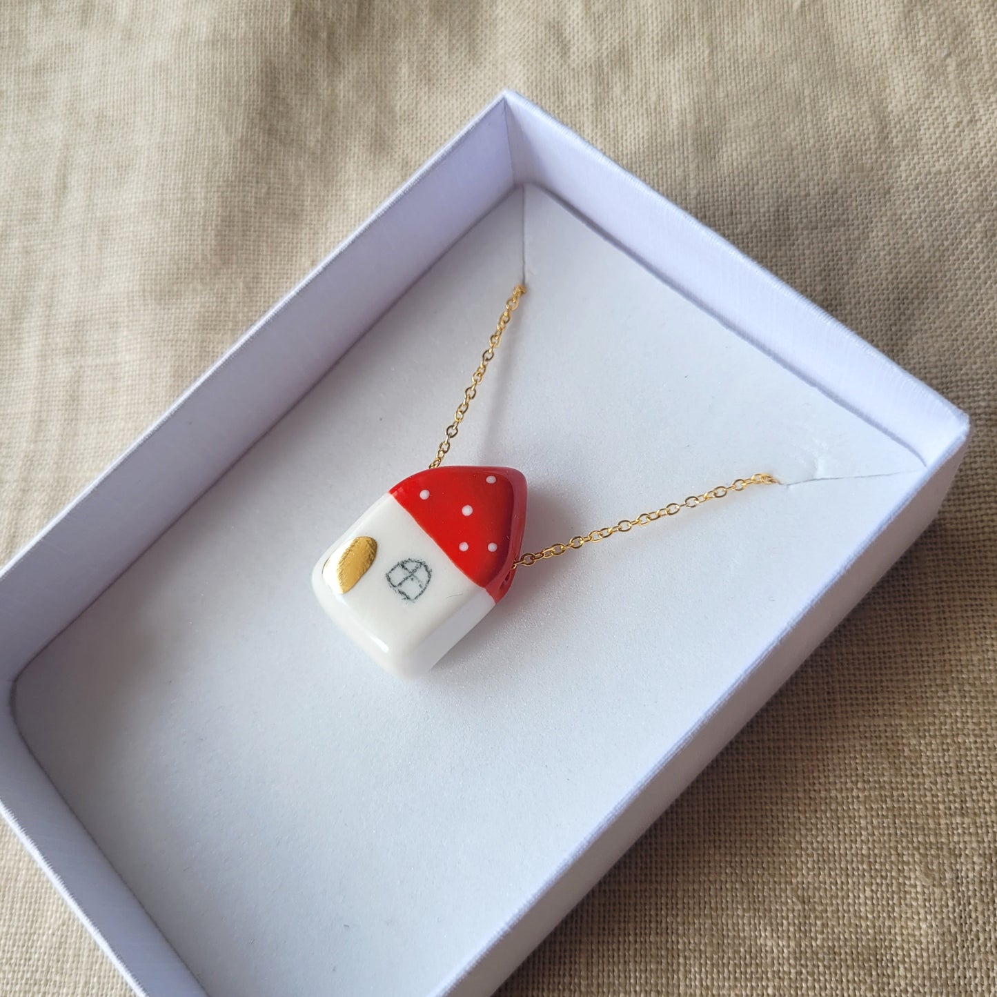 Porcelain necklace with gold "Red house with golden door"