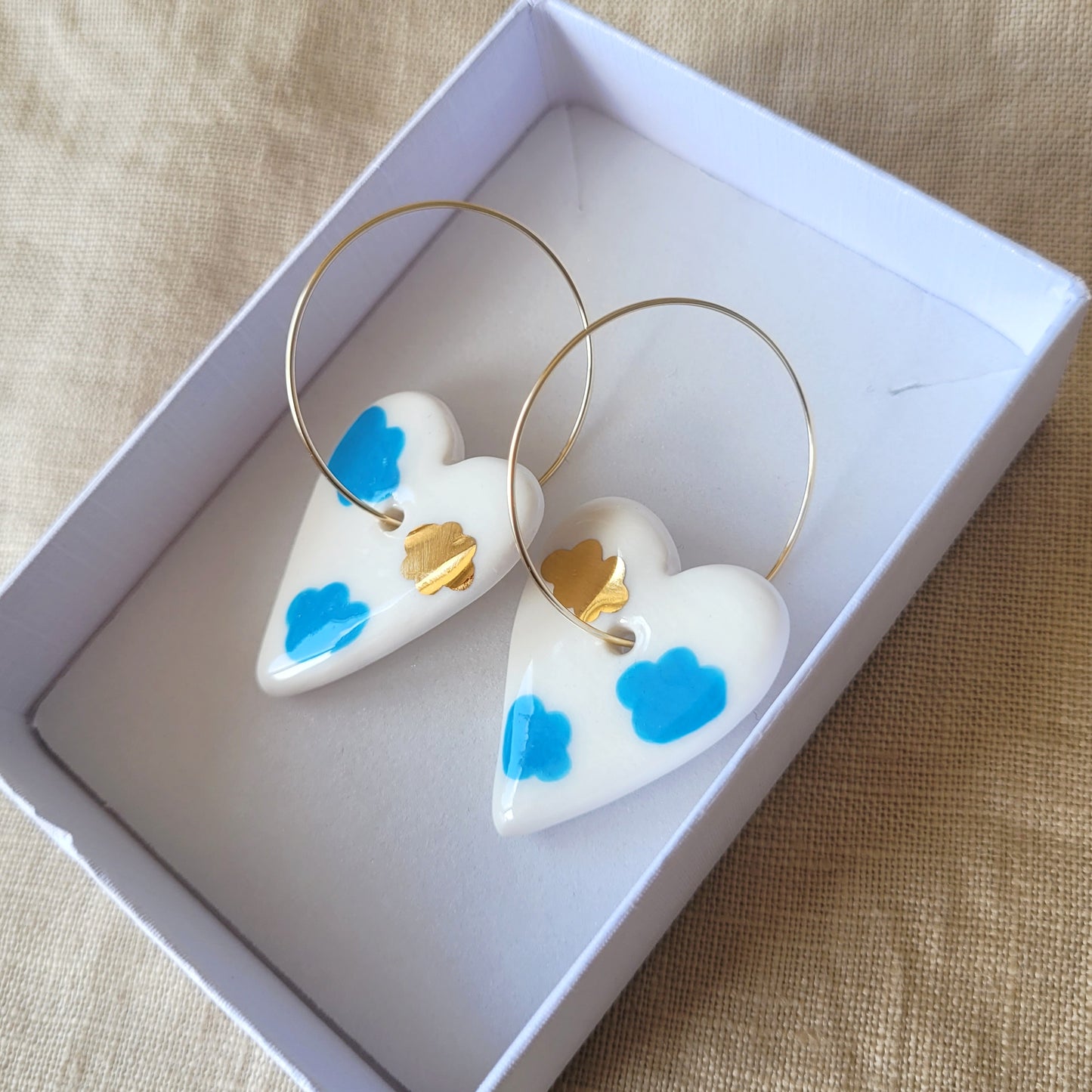 Porcelain dangle earrings with gold "Hearts with clouds"