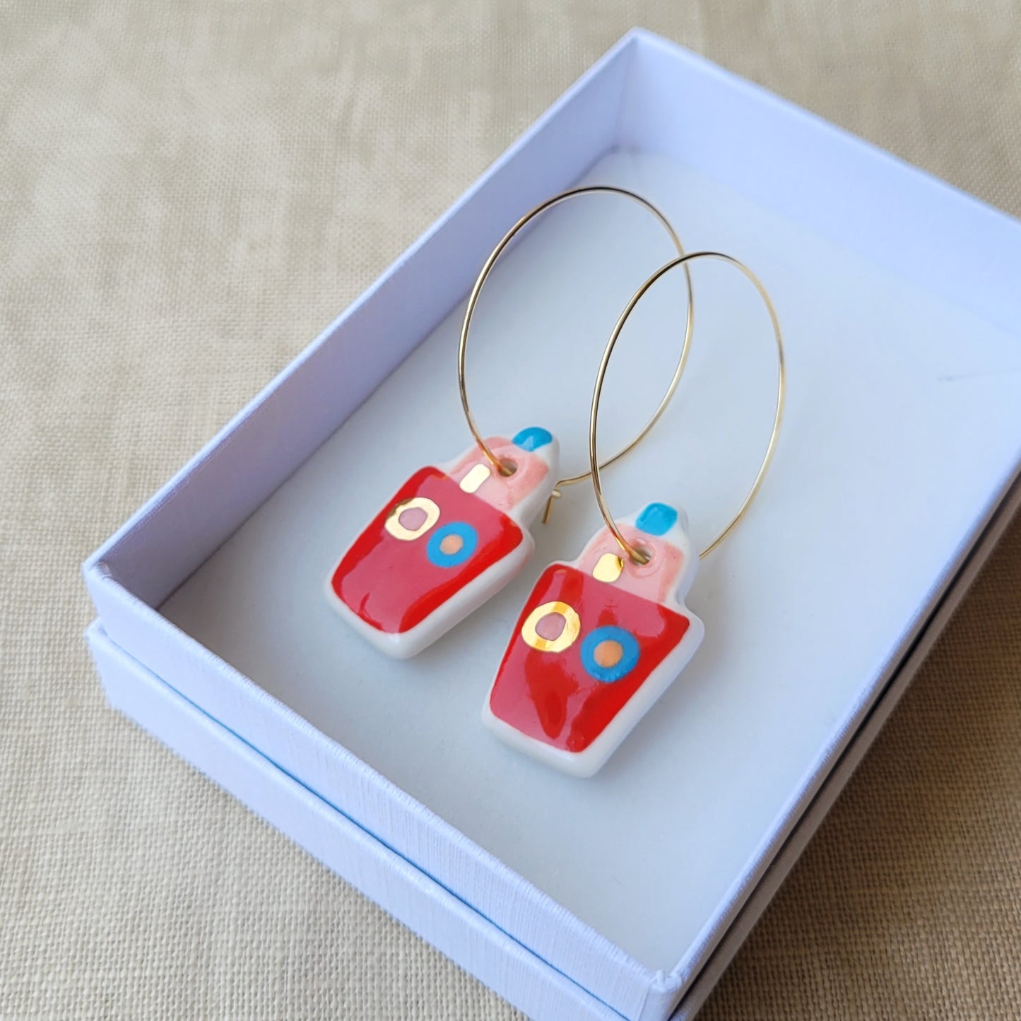 Porcelain dangle earrings with gold "Little red boats"