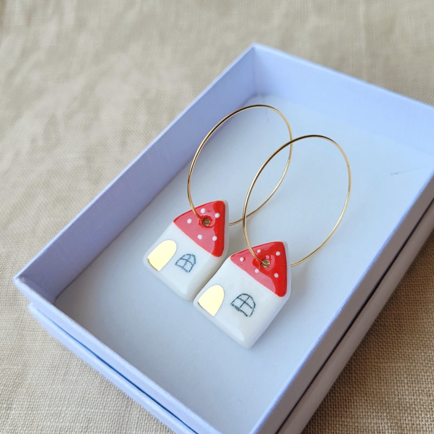 Porcelain dangle earrings with gold "Houses with dots"