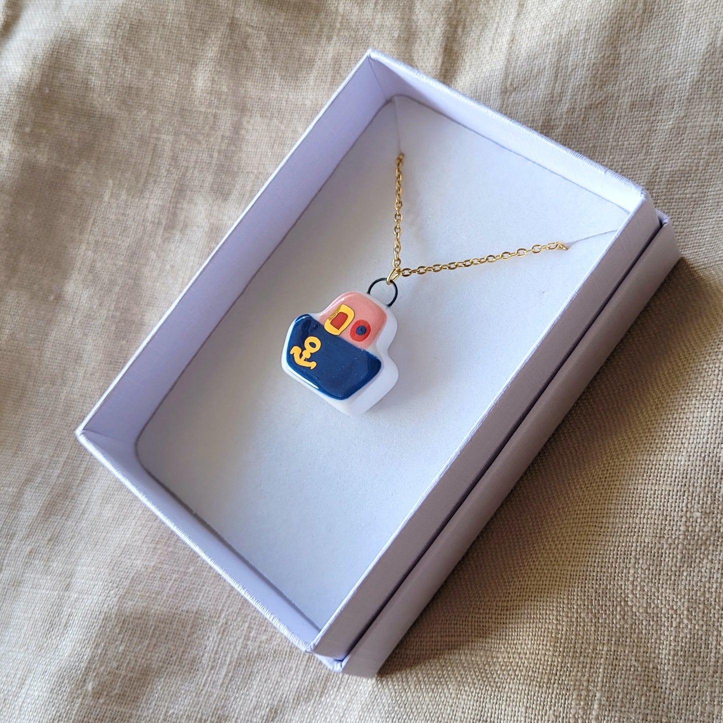 Porcelain necklace with gold "Dark blue boat"