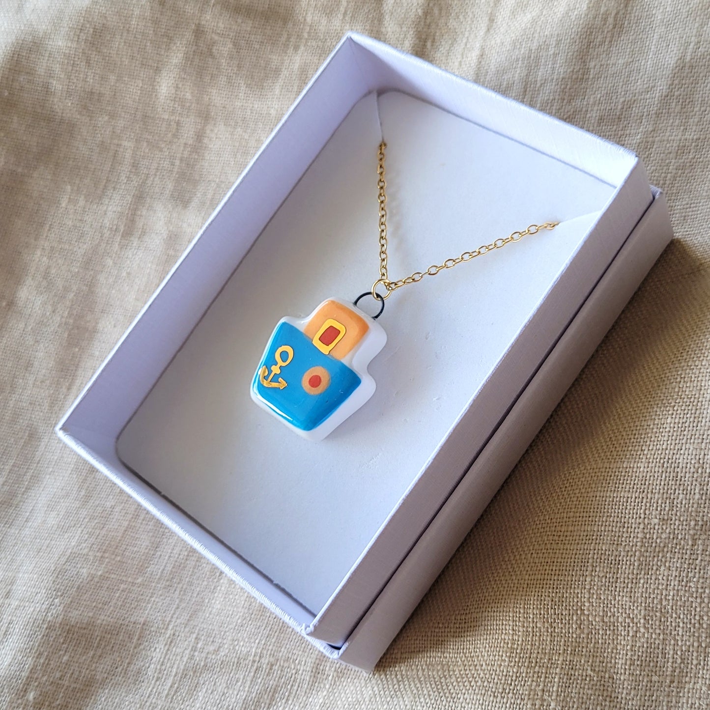 Porcelain necklace with gold "Blue boat"