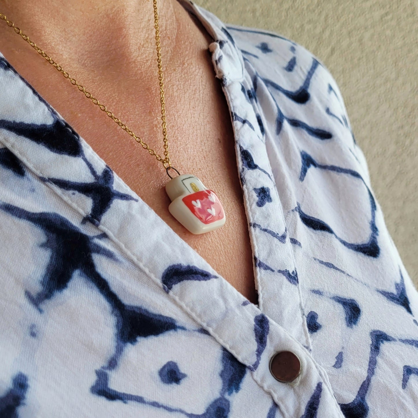 Porcelain necklace with gold "Boat with hearts"