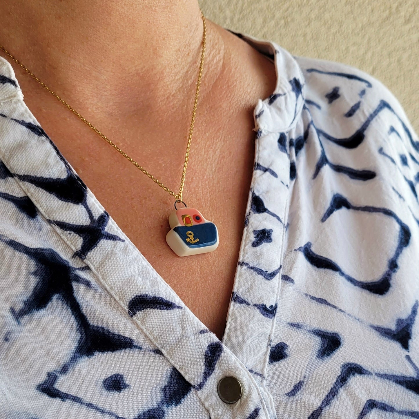 Porcelain necklace with gold "Dark blue boat"