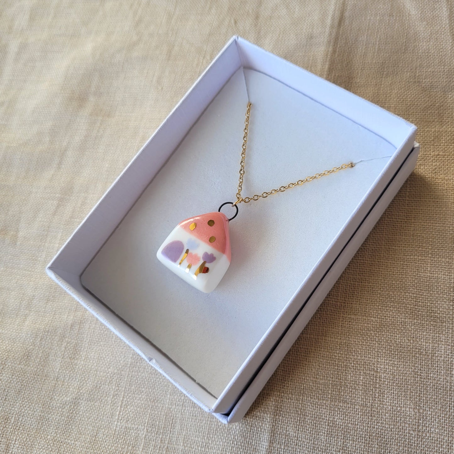 Porcelain necklace with gold "Pink house"