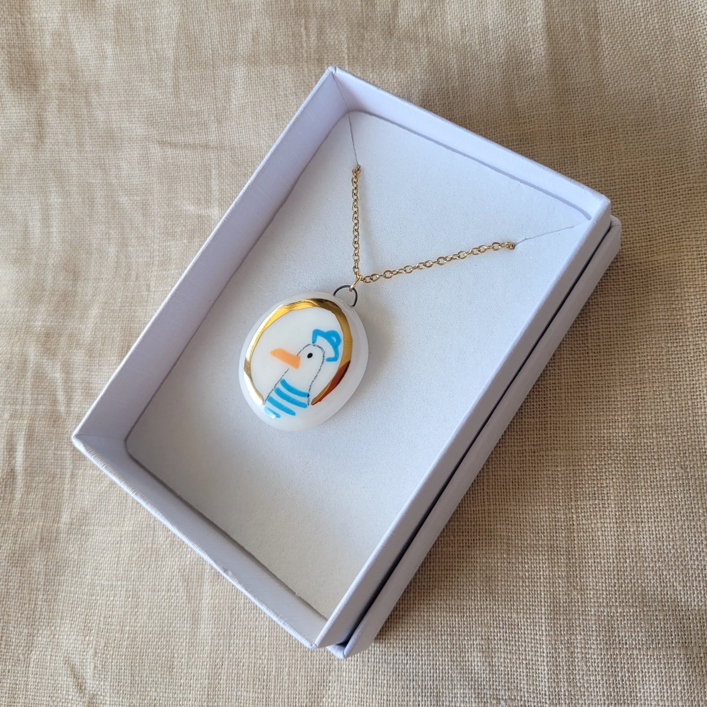 Porcelain necklace with gold "Seagull"