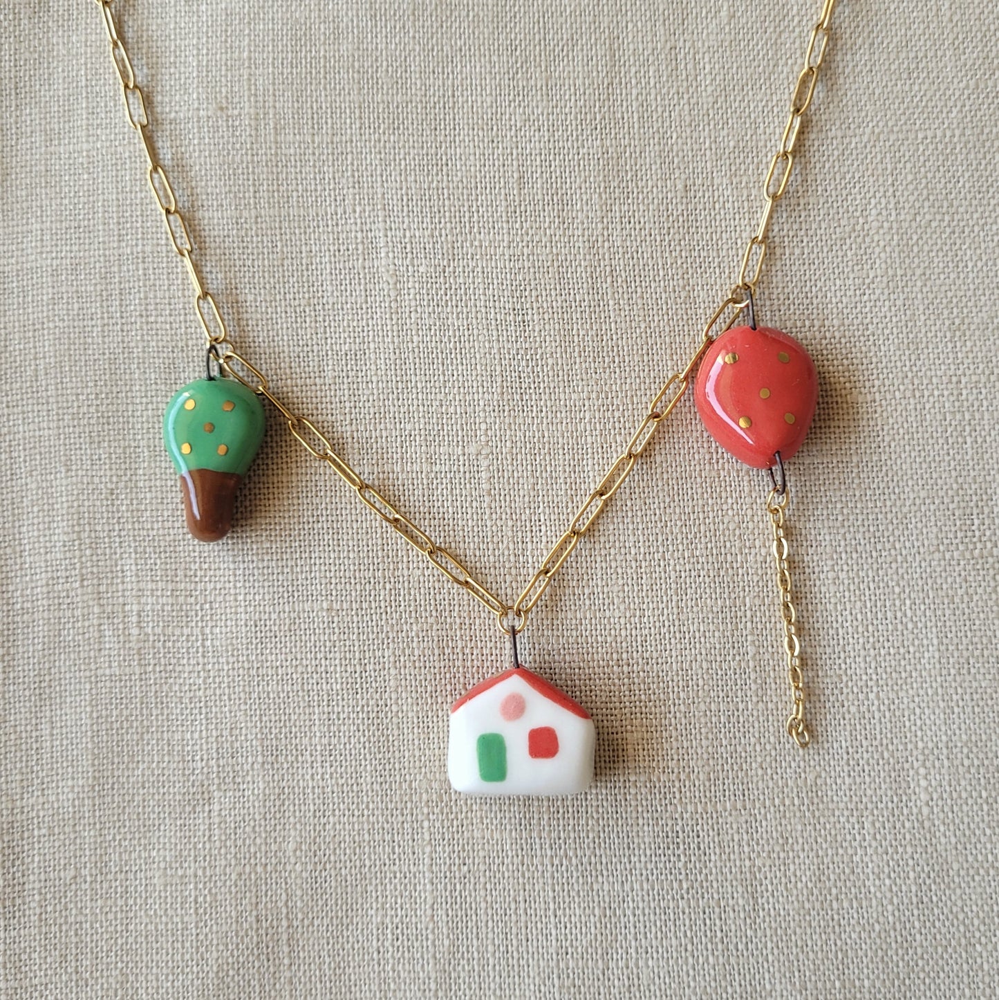 Porcelain necklace with gold "Red balloon, house and tree"