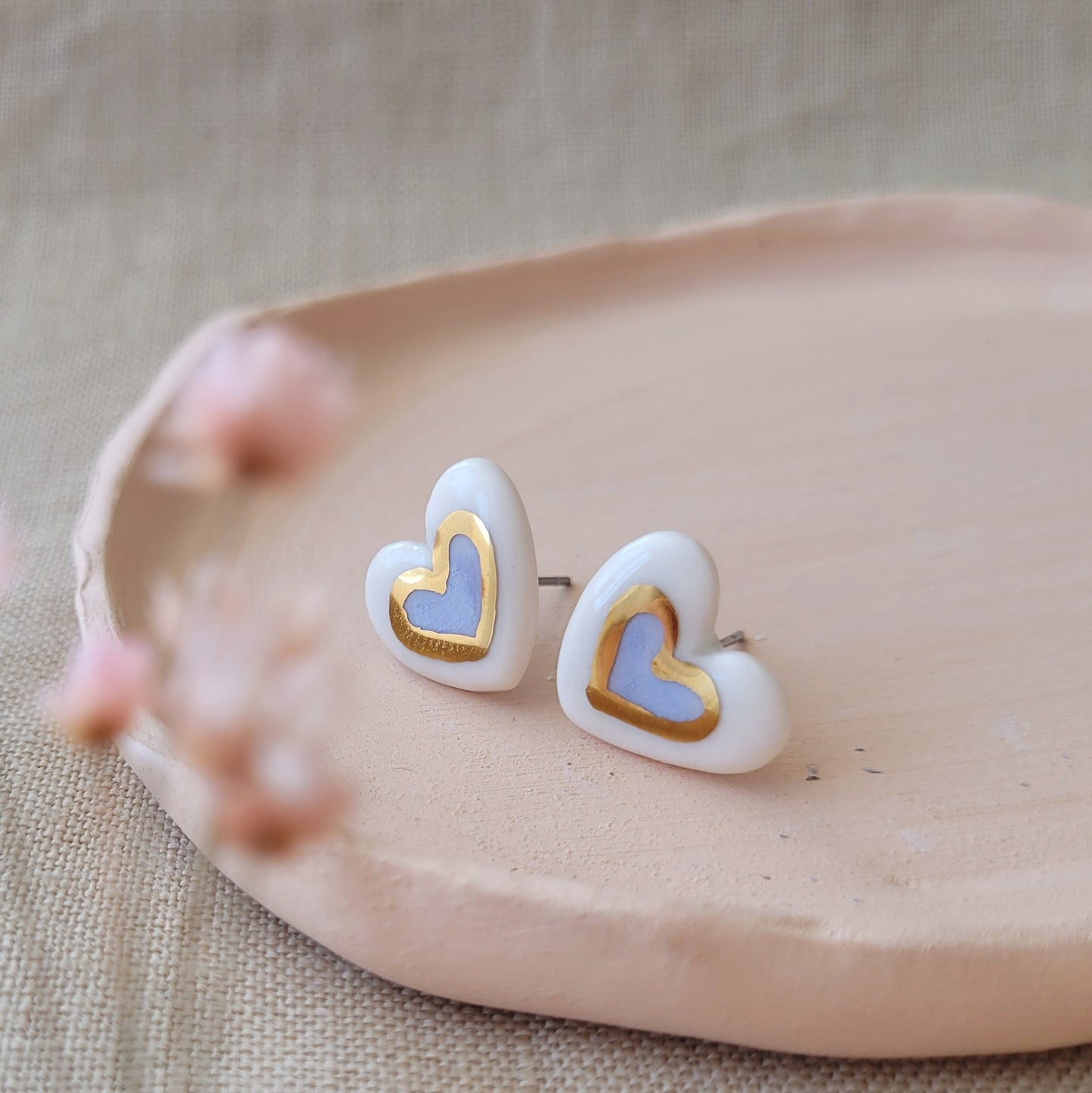 Porcelain stud earrings with gold "Light purple hearts with gold"