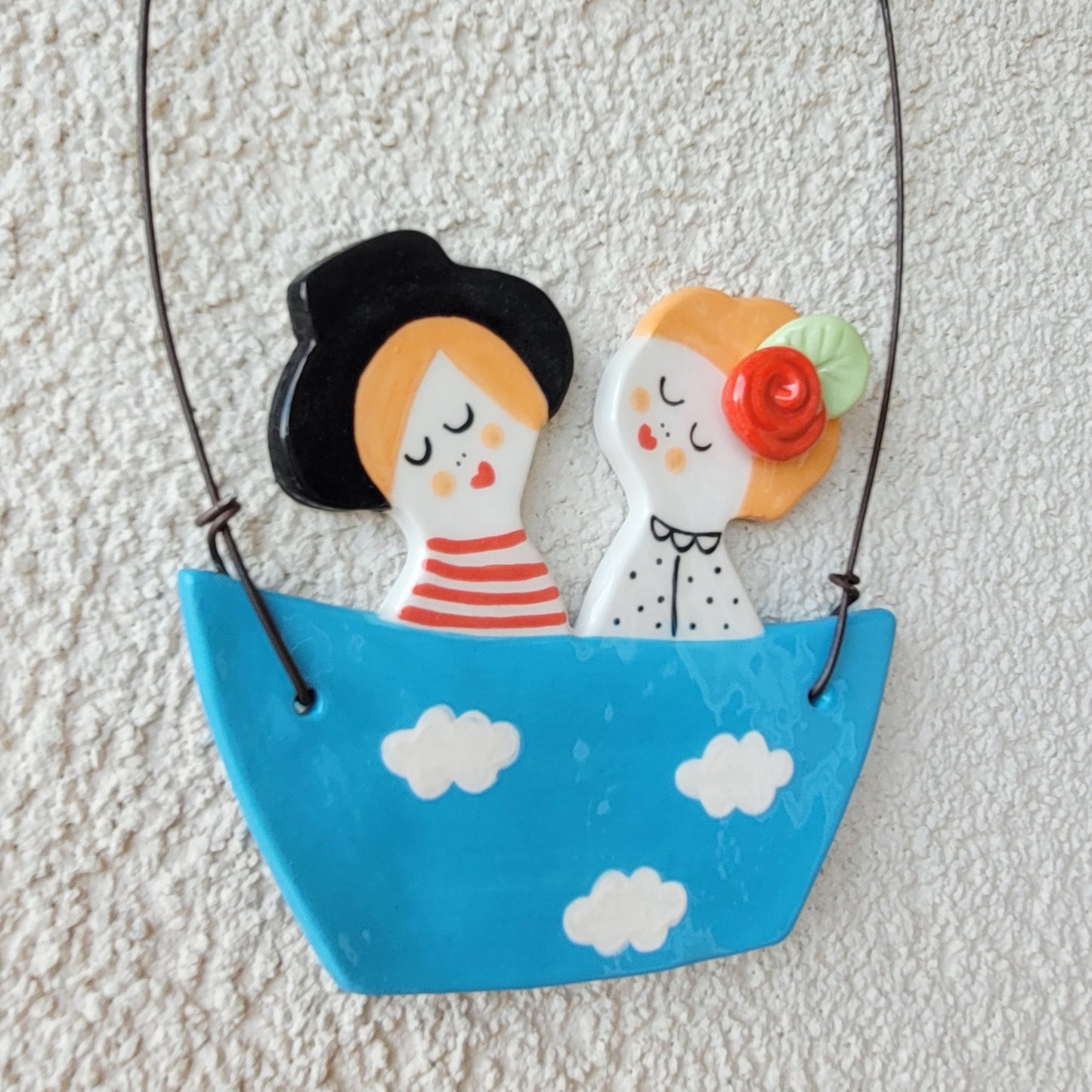Ceramic wall hanging "Happy couple in a blue boat"