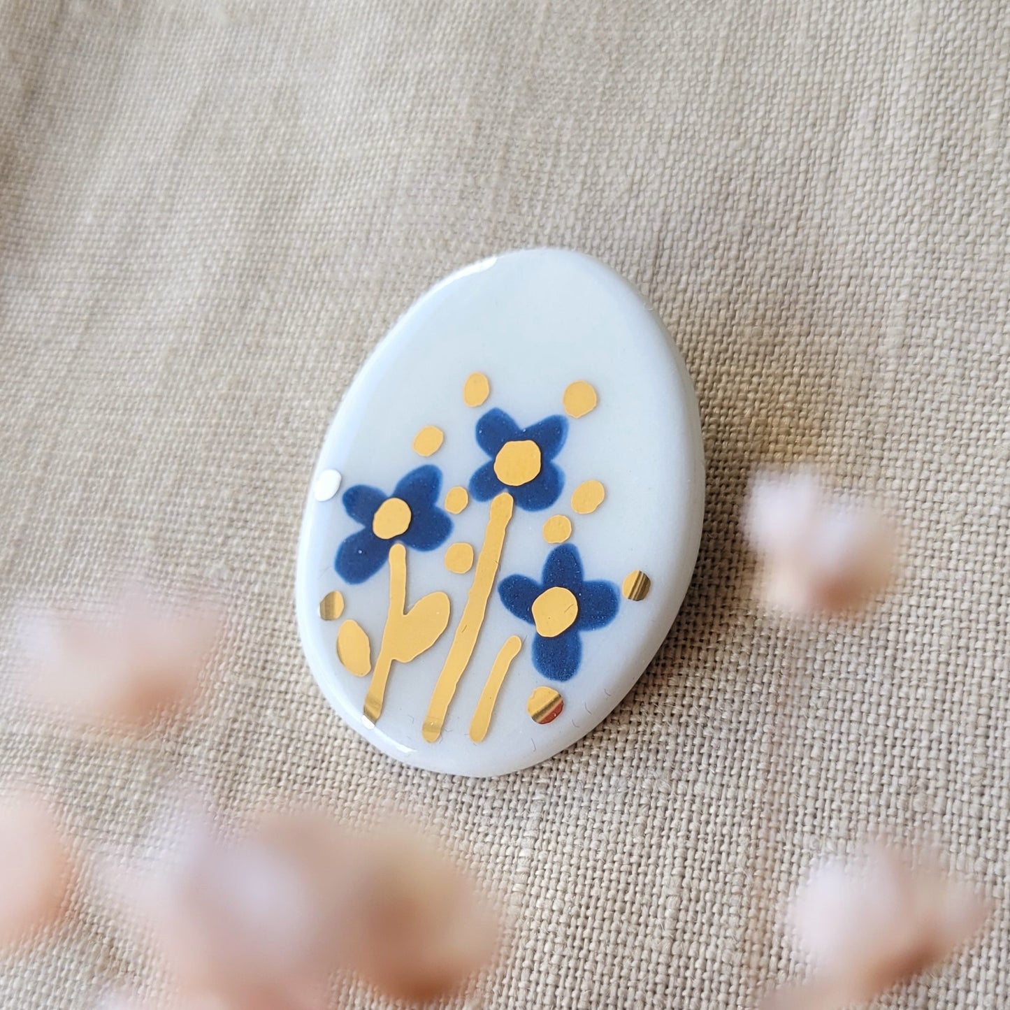 Porcelain brooch with gold "Blue flowers"