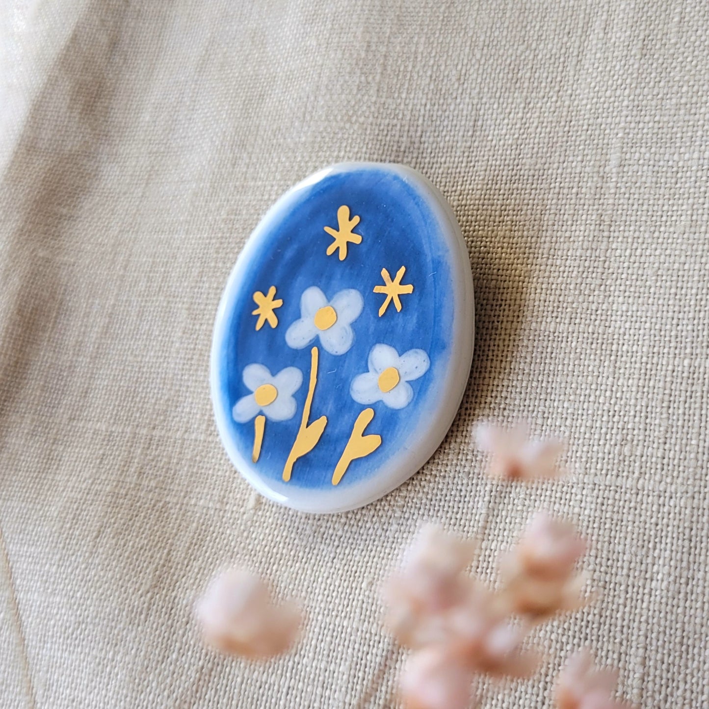 Porcelain brooch with gold "Blue night"