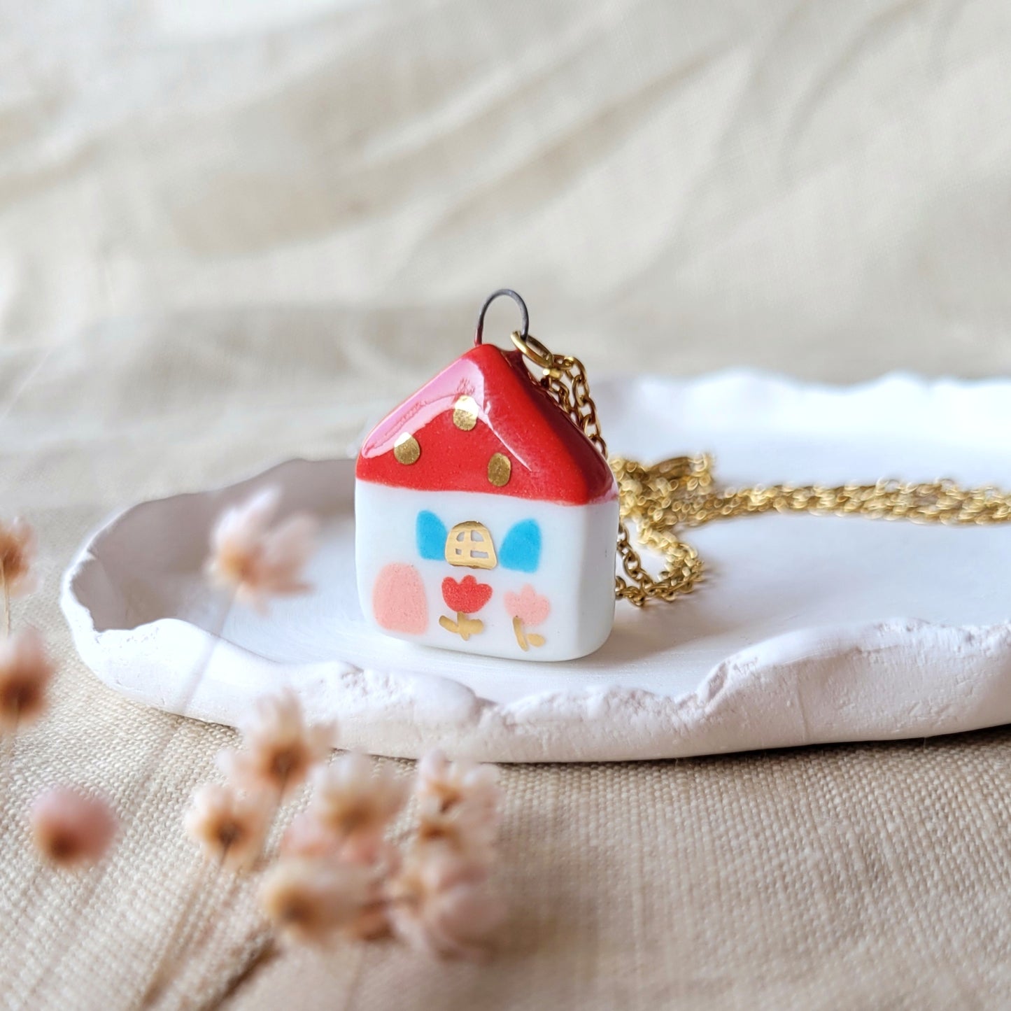 Porcelain necklace with gold "Red house with pink door"