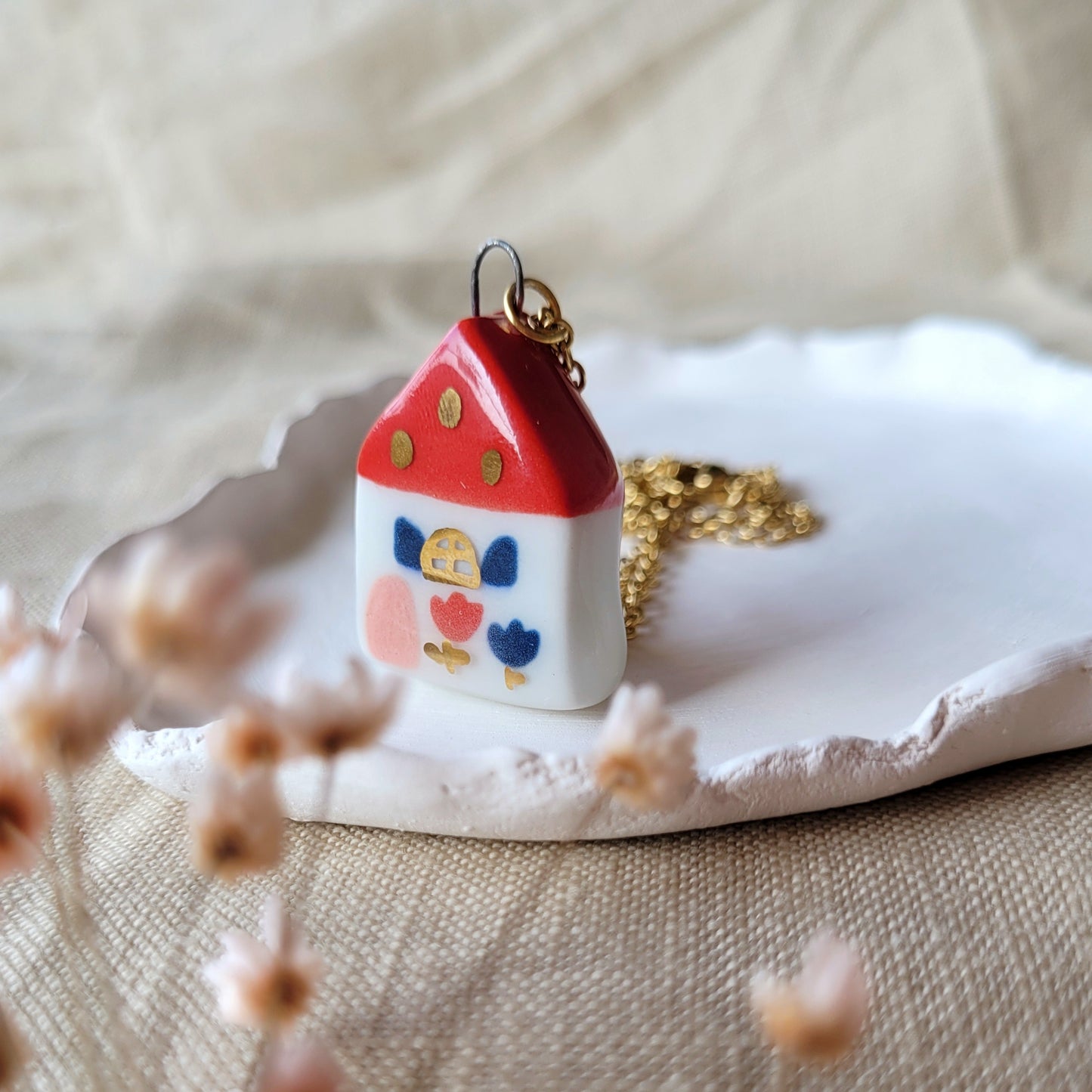 Porcelain necklace with gold "Red house with blue windows"