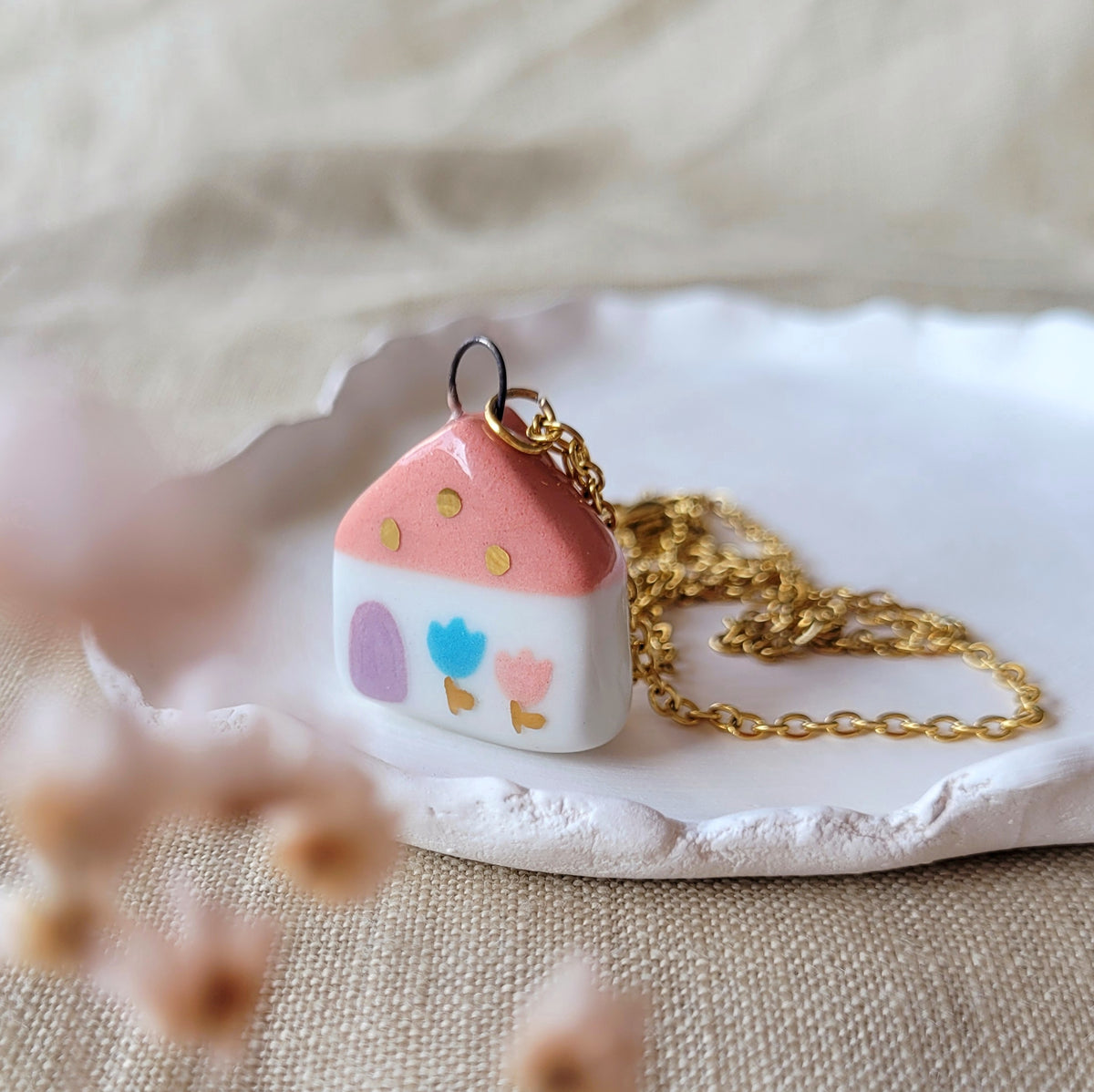 Porcelain necklace with gold "Pink house with blue tulip"