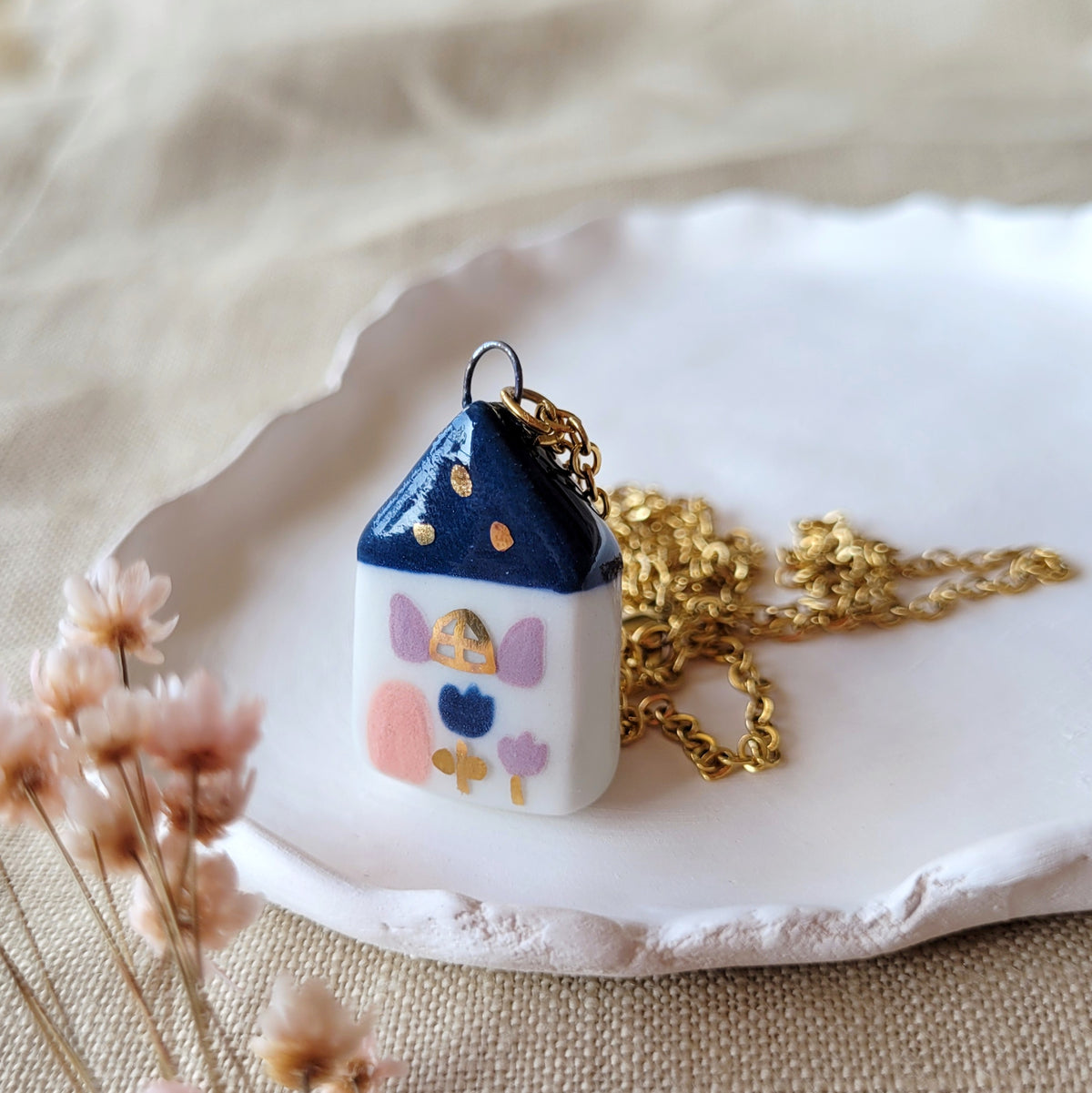 Porcelain necklace with gold "Dark blue house with pink door"
