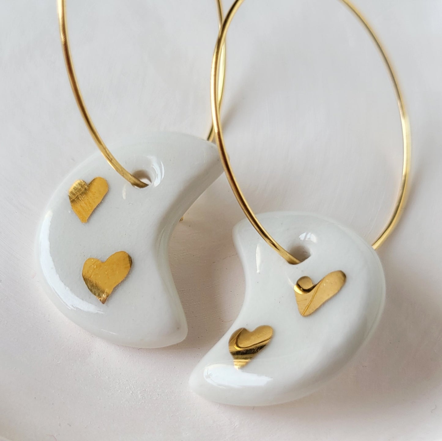 Porcelain dangle earrings with gold "White moons with little gold hearts"