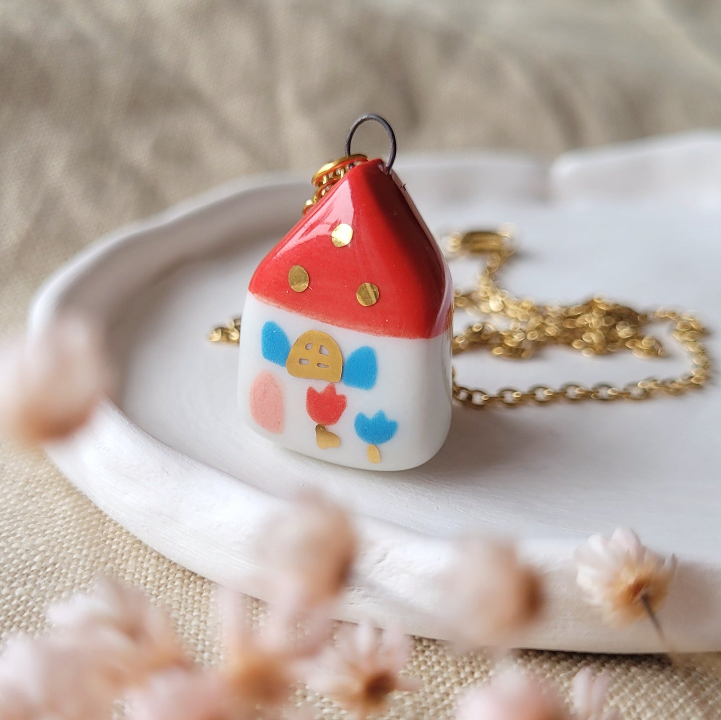 Porcelain necklace with gold "Red house with pink door"