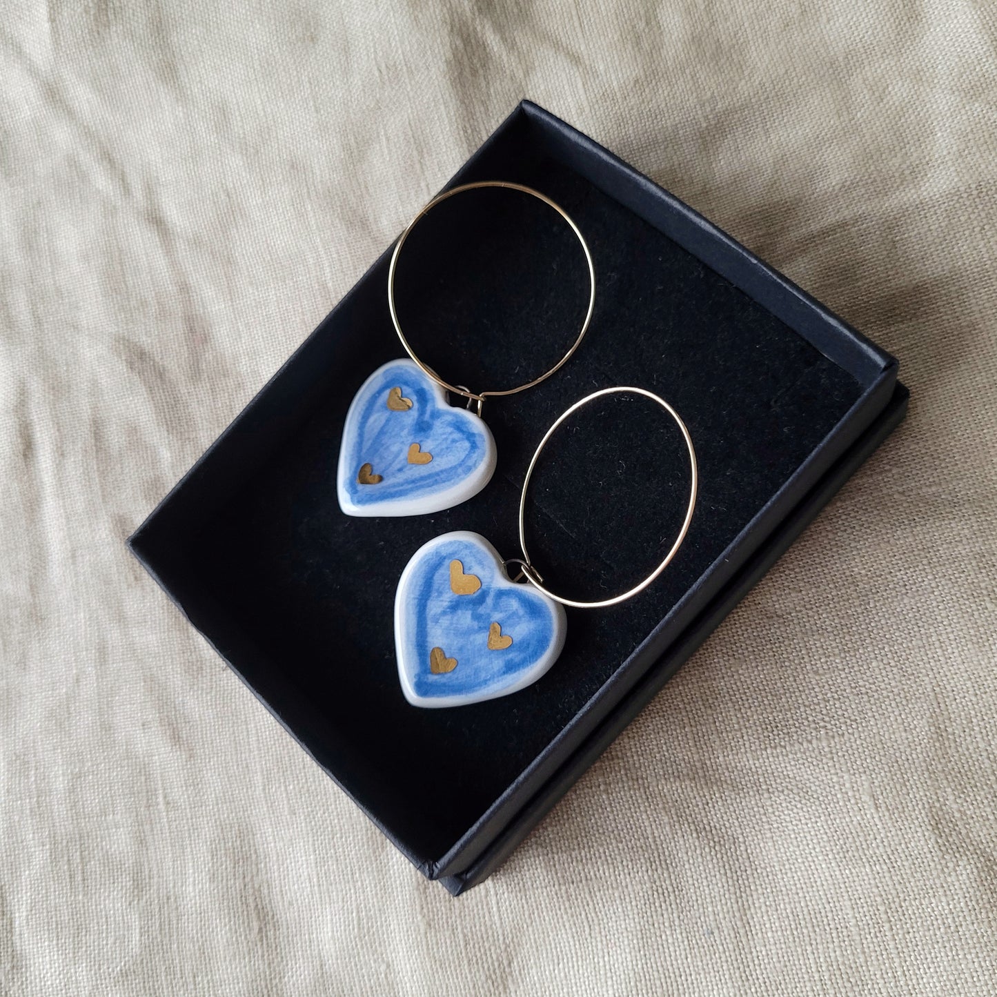 Porcelain dangle earrings with gold "Dark blue hearts"