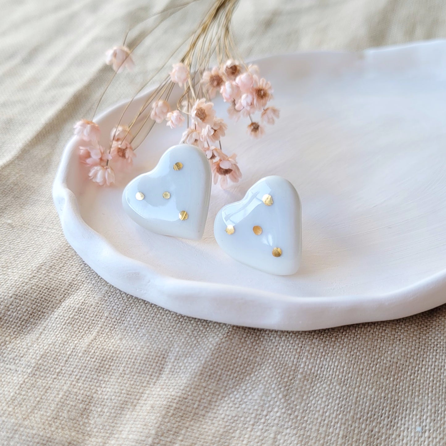 Porcelain stud earrings with gold "White hearts with touch of purple"