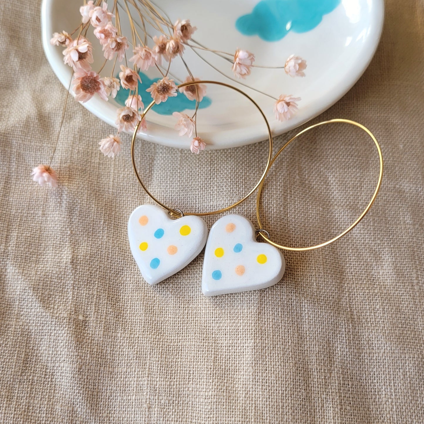 Ceramic dangle earrings "Small white hearts with dots"