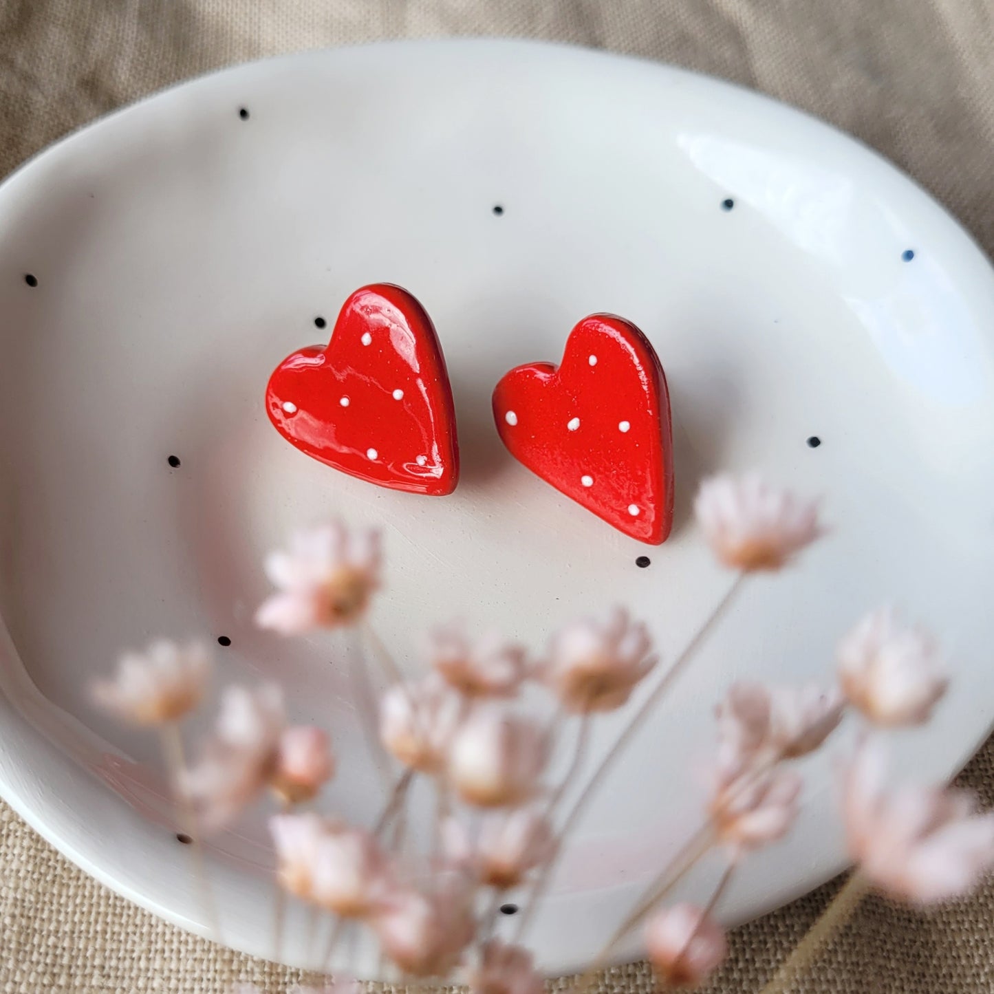 Ceramic stud earrings "Red hearts with white dots"