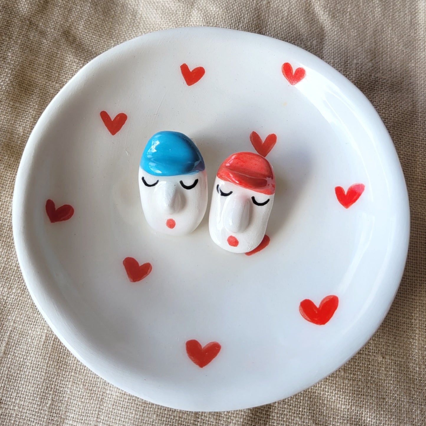 Ceramic mismatched stud earrings "Funny faces with hats"