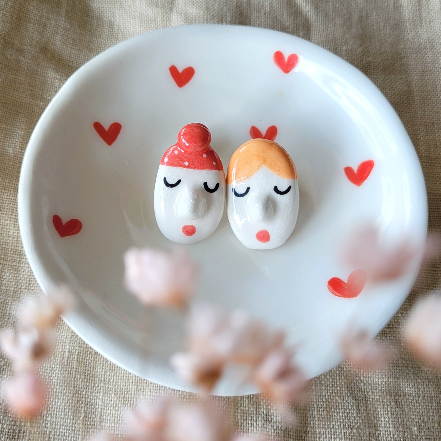 Ceramic mismatched stud earrings "Funny faces and red hat"