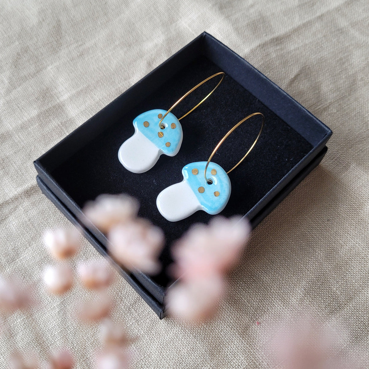 Porcelain dangle earrings with gold "Light blue mushrooms"