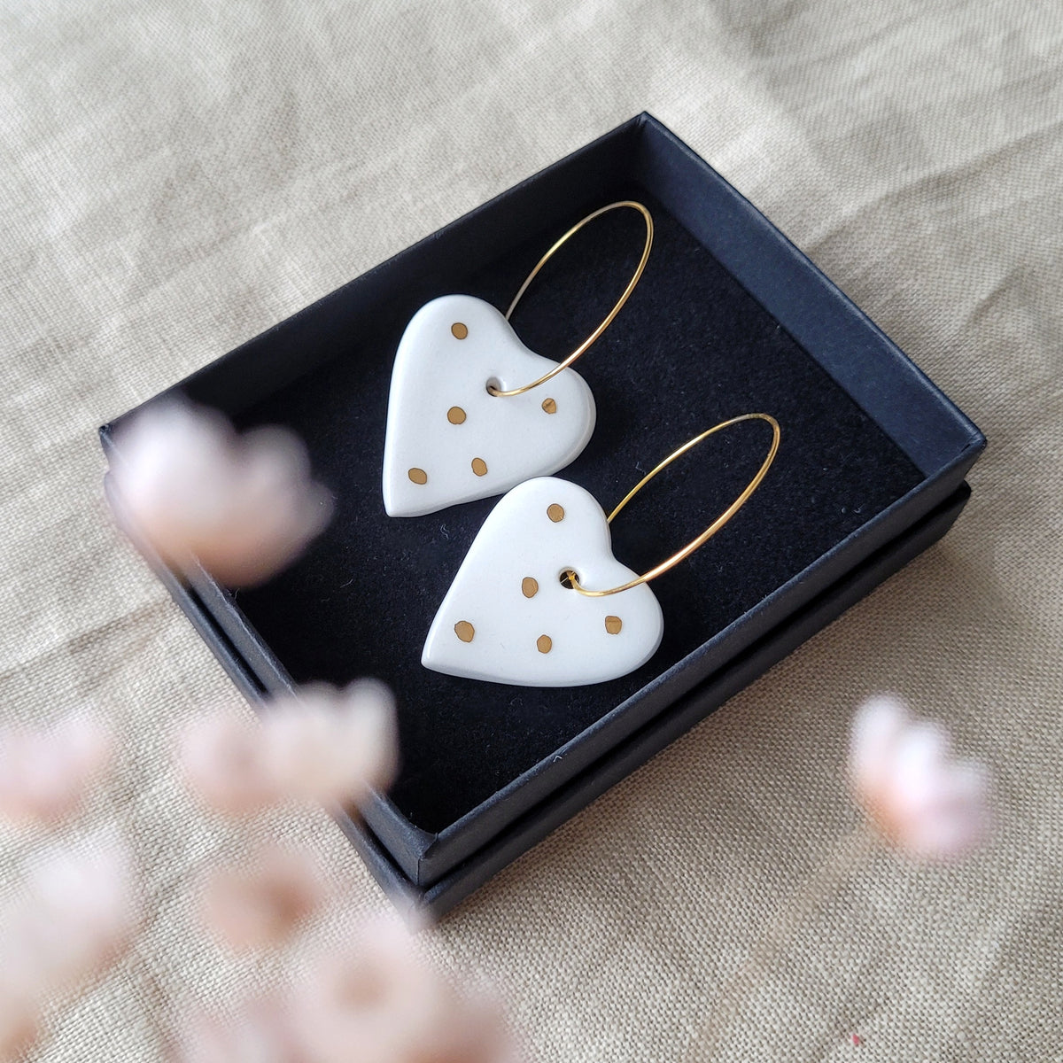 Porcelain dangle earrings with gold "White hearts"