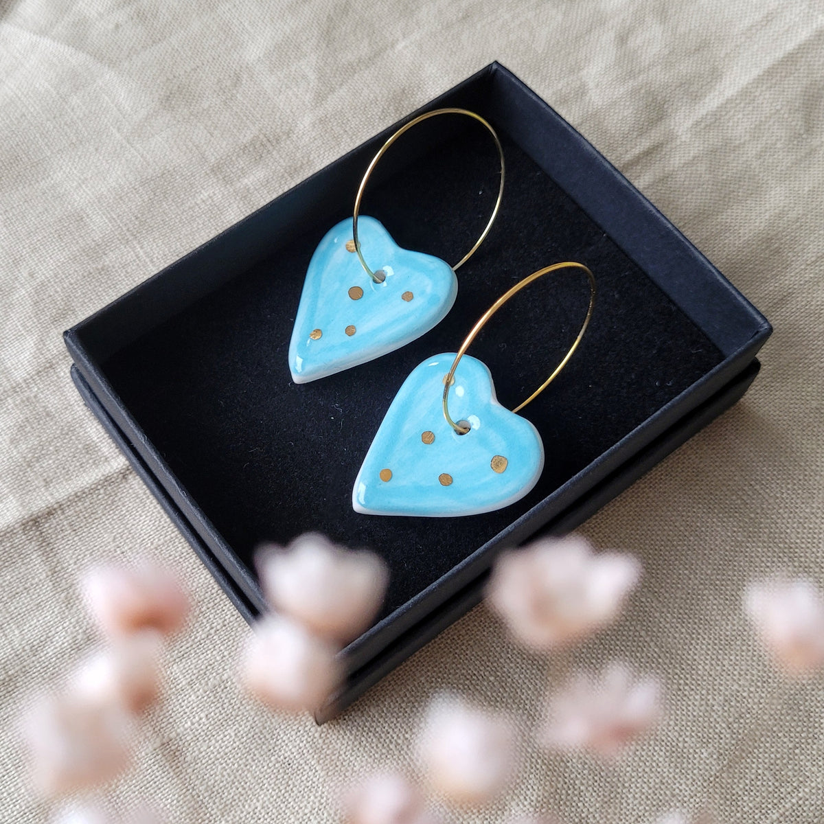 Porcelain dangle earrings with gold "Light blue hearts"