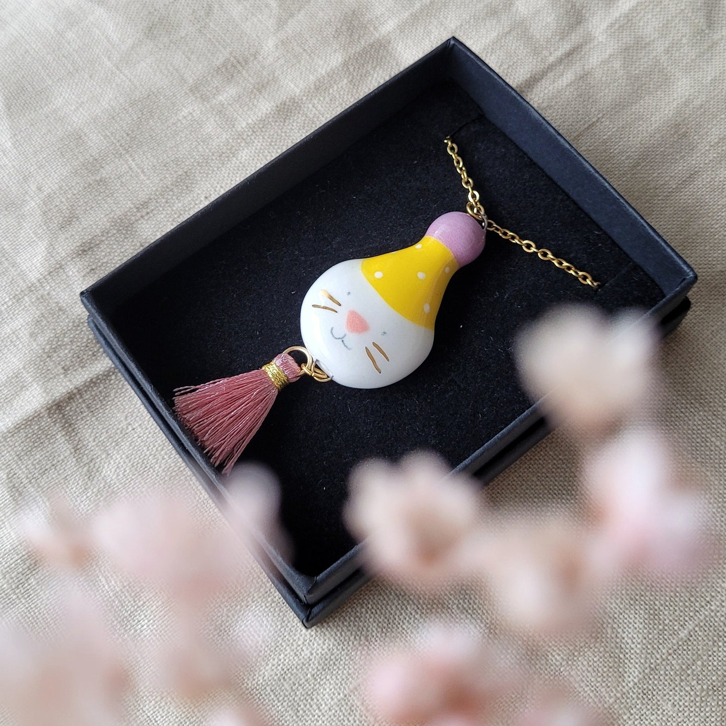 Porcelain necklace with gold "Big party kitty with yellow hat"