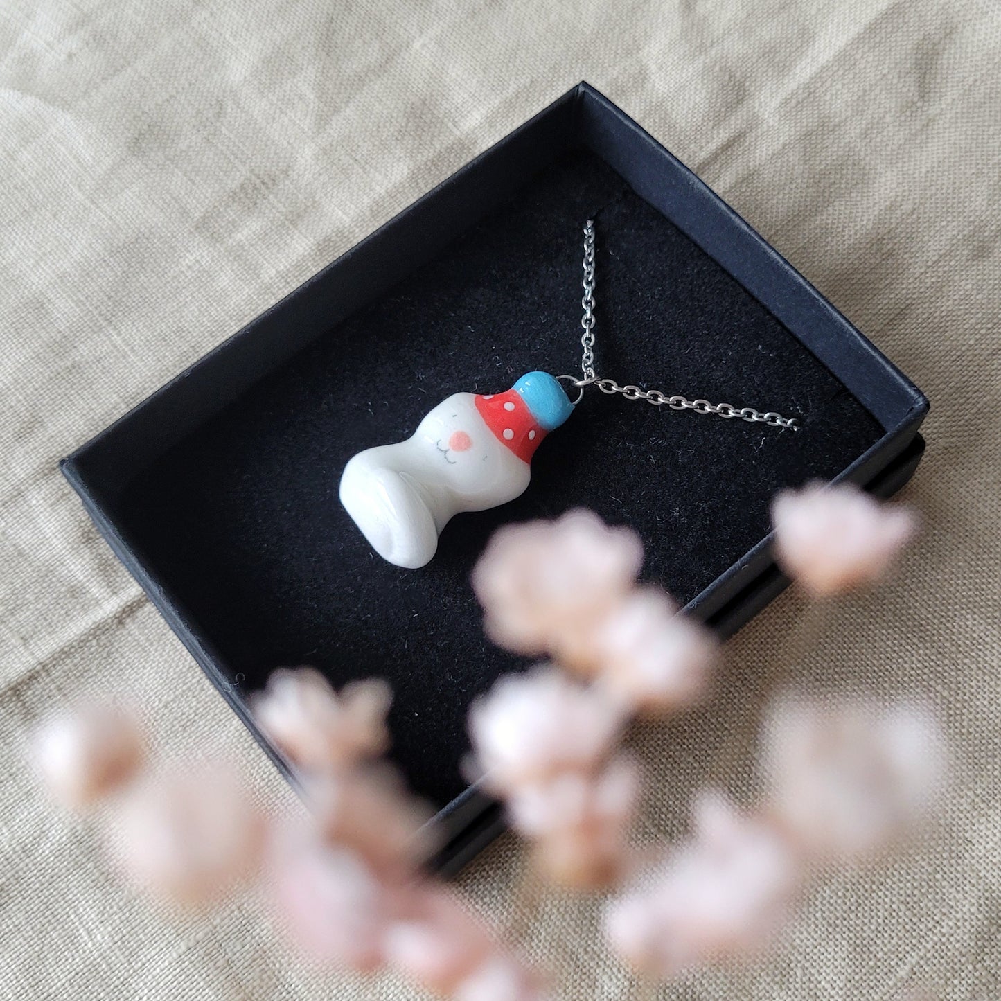 Porcelain necklace "Small party kitty with red hat"