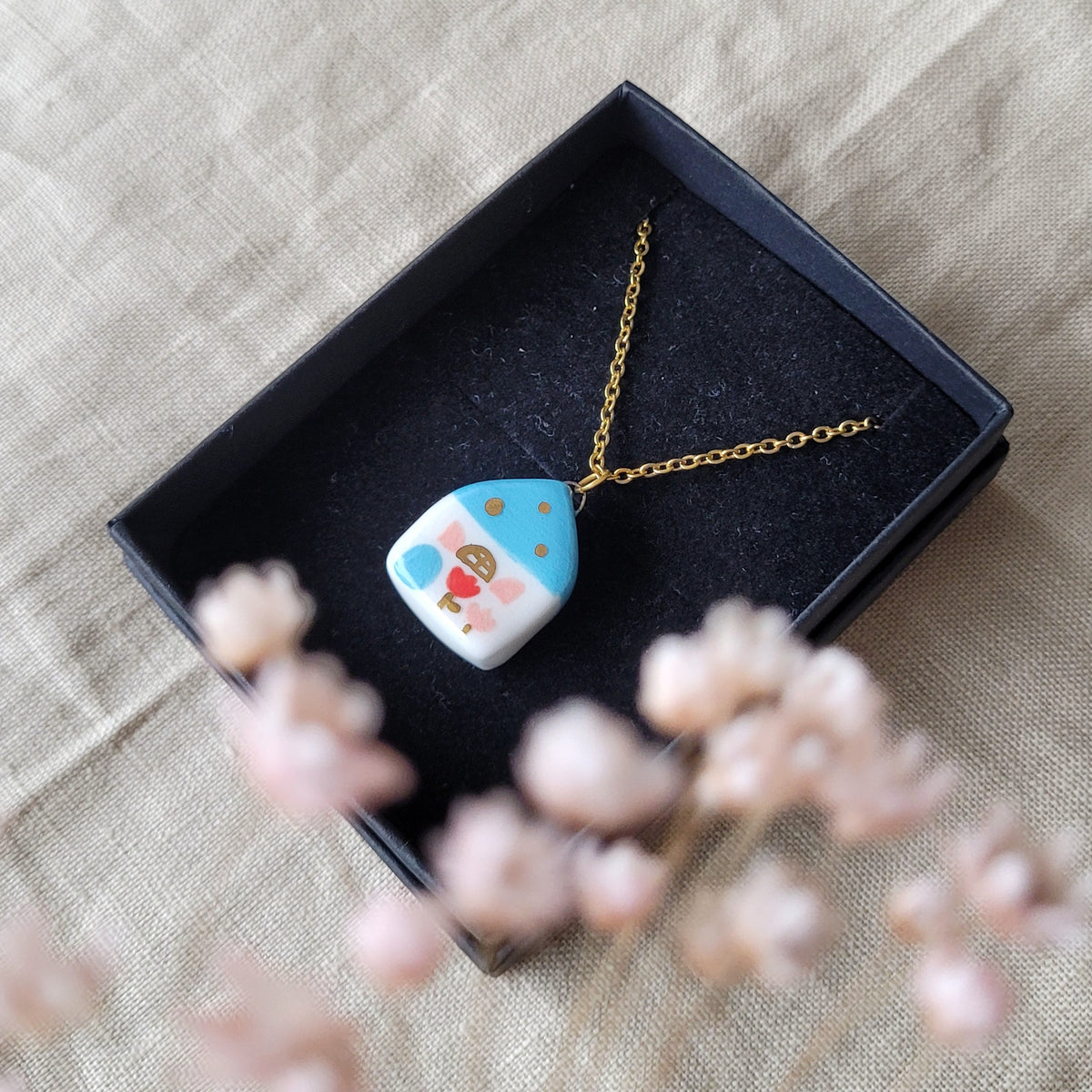 Porcelain necklace with gold "Blue house with red and pink tulip"