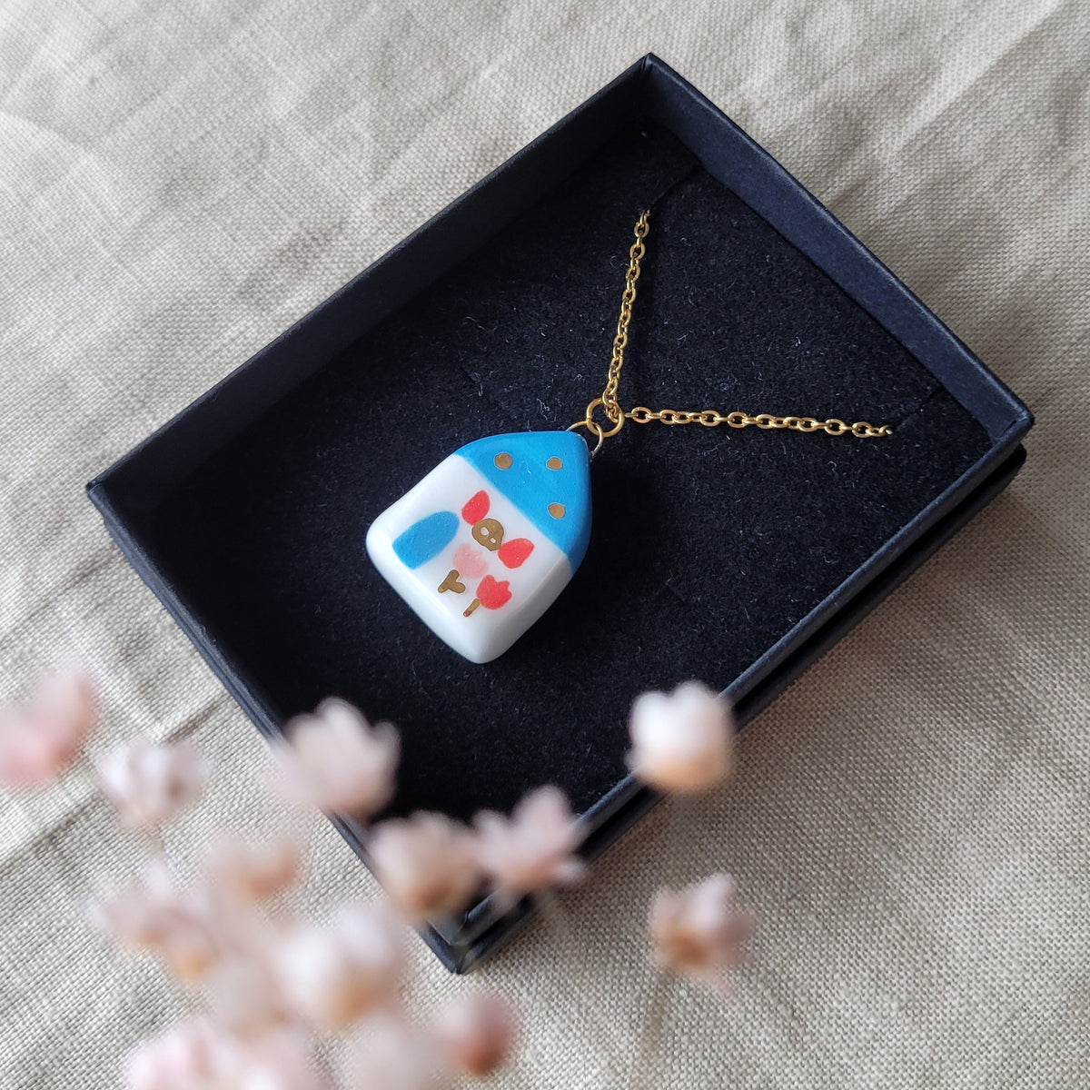 Porcelain necklace with gold "Blue house with red window"