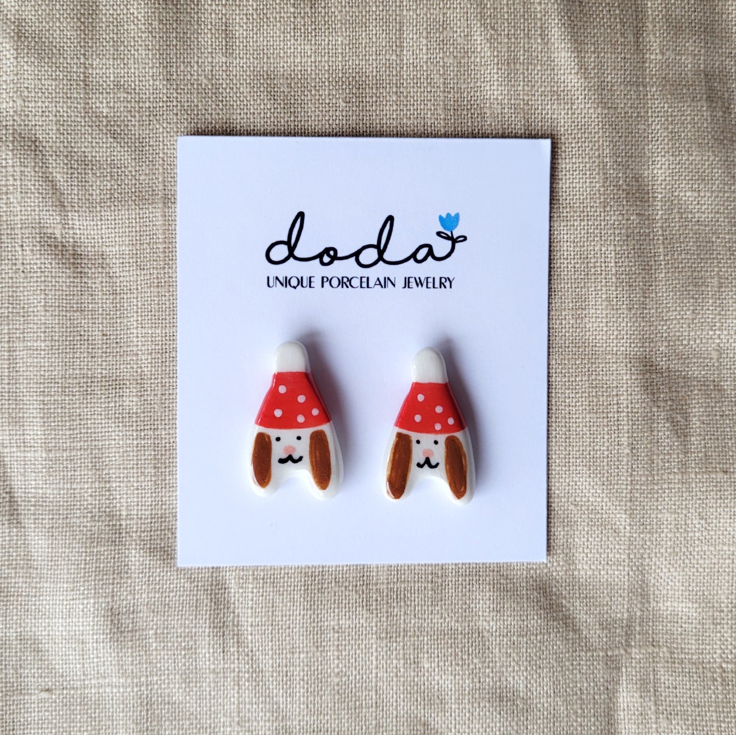 Porcelain stud earrings "Puppies with red hats"