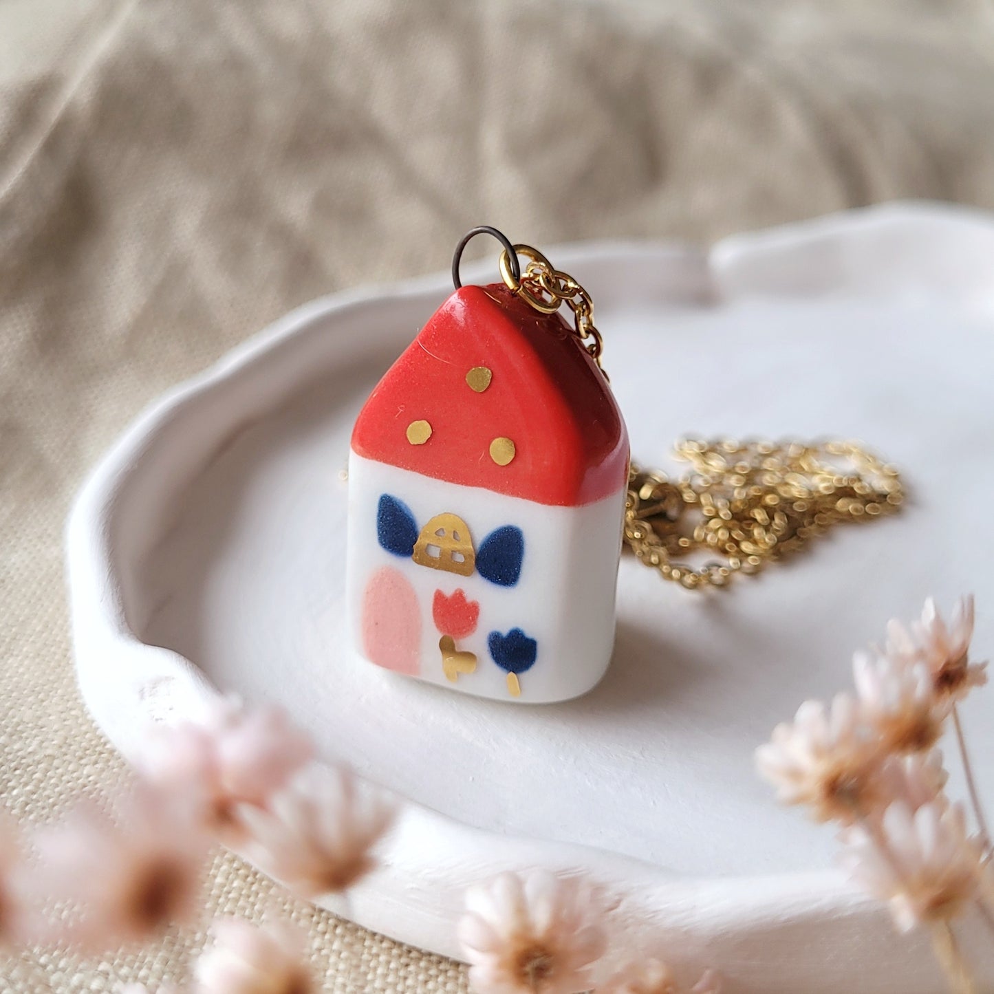 Porcelain necklace with gold "Red house with dark blue window"