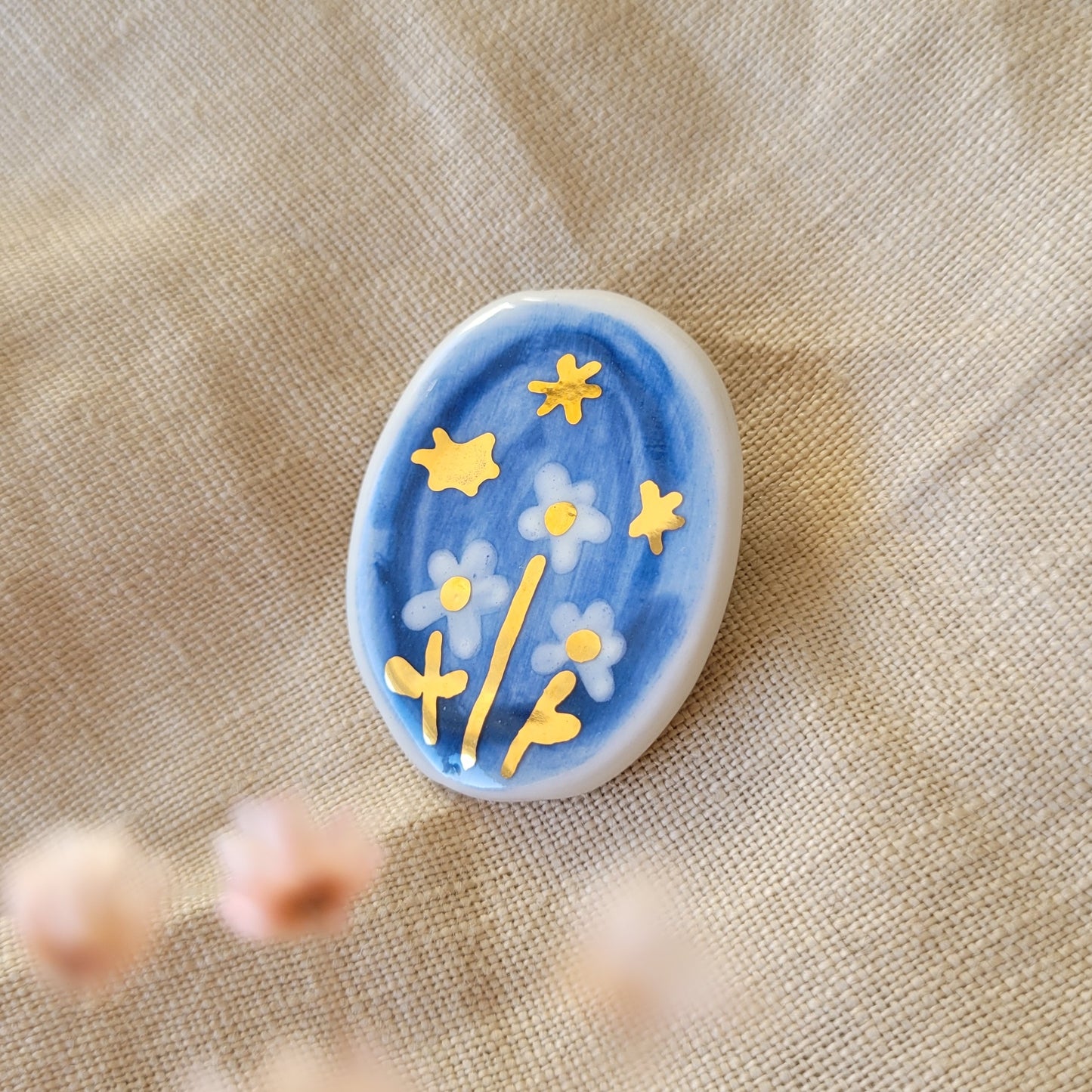 Porcelain brooch with gold "Starry night"